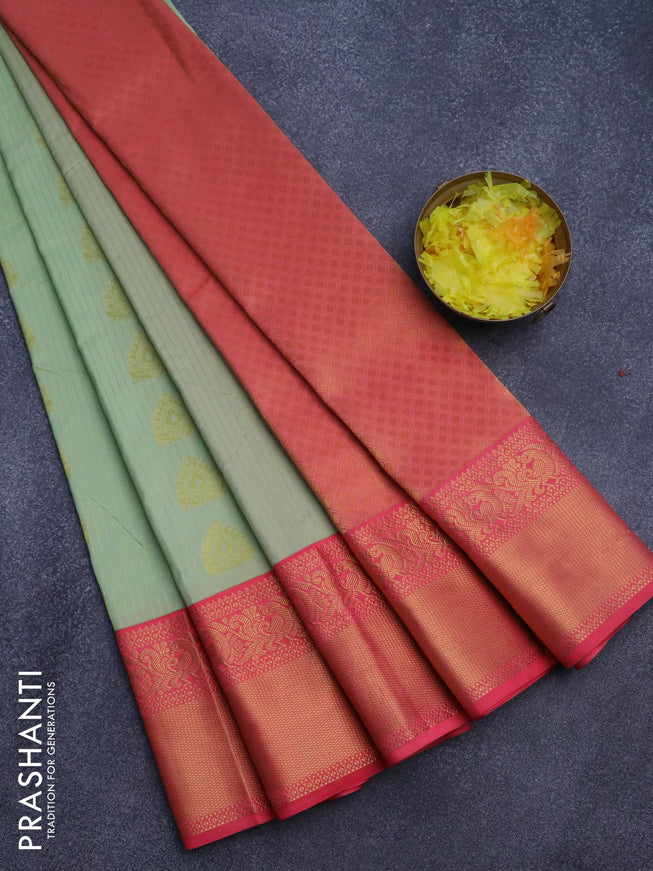 Semi kanjivaram silk saree pastel green shade and peach pink with allover zari weaves and zari woven korvai border