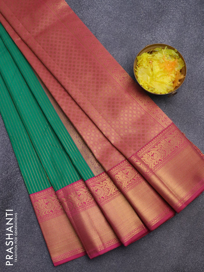 Semi kanjivaram silk saree green and magenta pink with allover zari weaves and zari woven korvai border