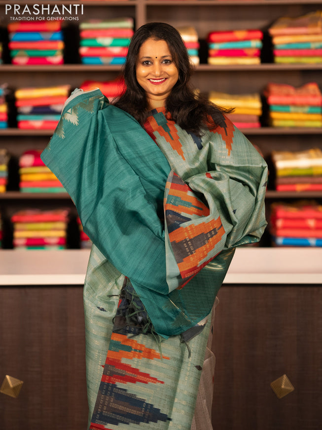 Semi tussar saree teal green shade with allover zari weaves and temple design border