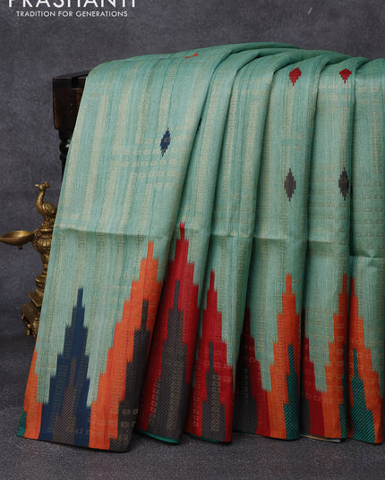 Semi tussar saree teal green shade with allover zari weaves and temple design border