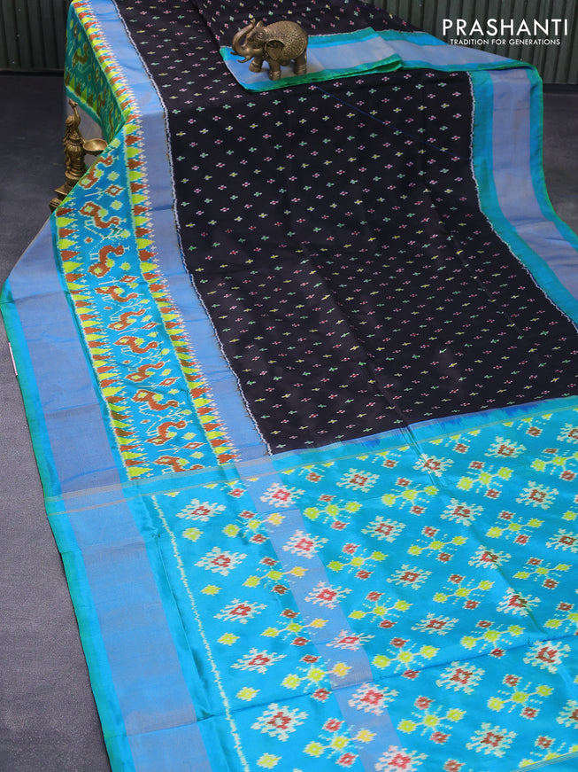 Pochampally silk saree black and dual shade of teal bluish green with allover ikat butta weaves and ikat design zari woven border