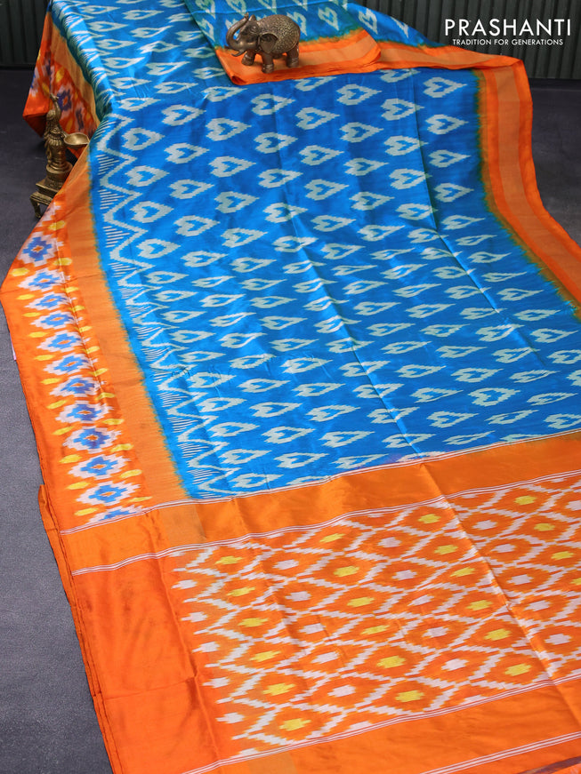 Pochampally silk saree dual shade of cs blue and orange with allover ikat woven butta weaves and zari woven ikat style border