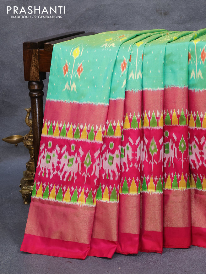 Pochampally silk saree teal green and pink with allover ikat weaves and ikat style zari woven border