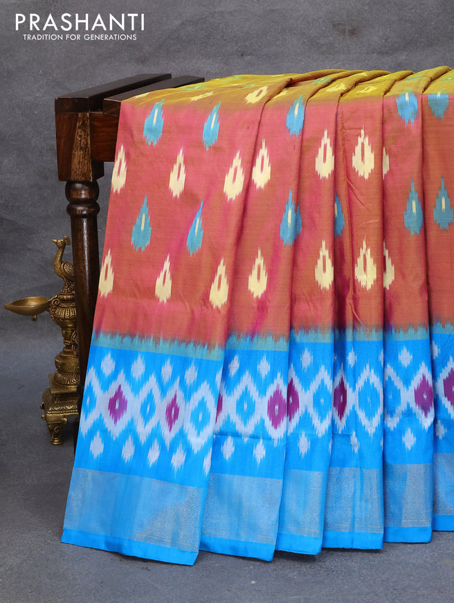Pochampally silk saree dual shade of greenish pink and cs blue with allover ikat woven butta weaves and ikat style zari woven border