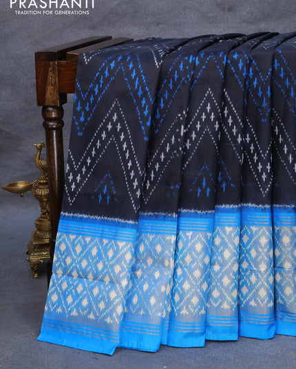 Pochampally silk saree black and cs blue with allover ikat weaves and long ikat woven zari border