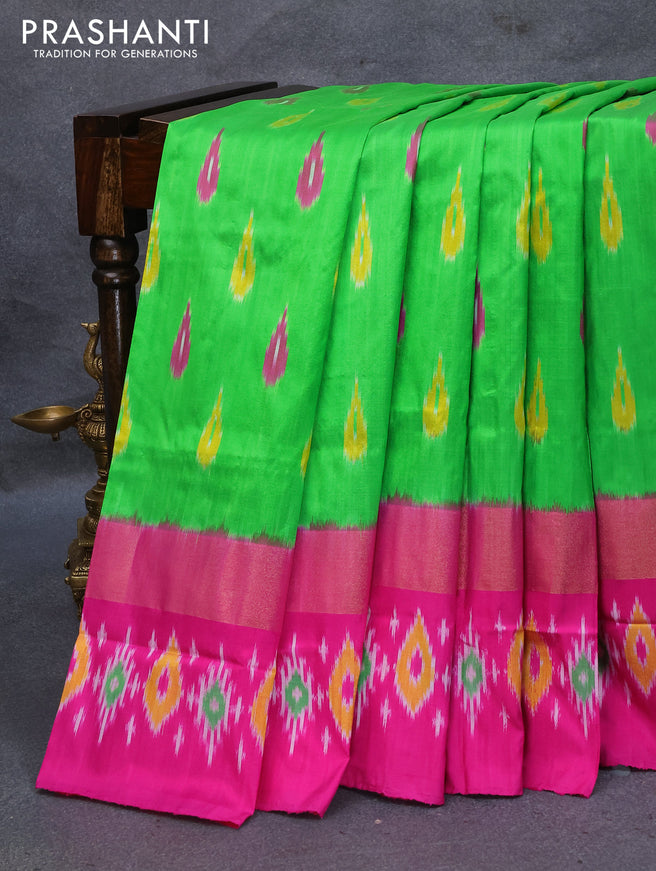 Pochampally silk saree parrot green and pink with allover ikat woven butta weaves and zari woven ikat style border