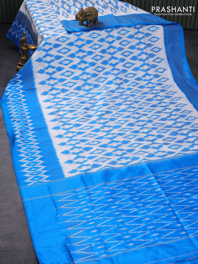Pochampally silk saree off white and cs blue with allover ikat weaves and zari woven ikat style border