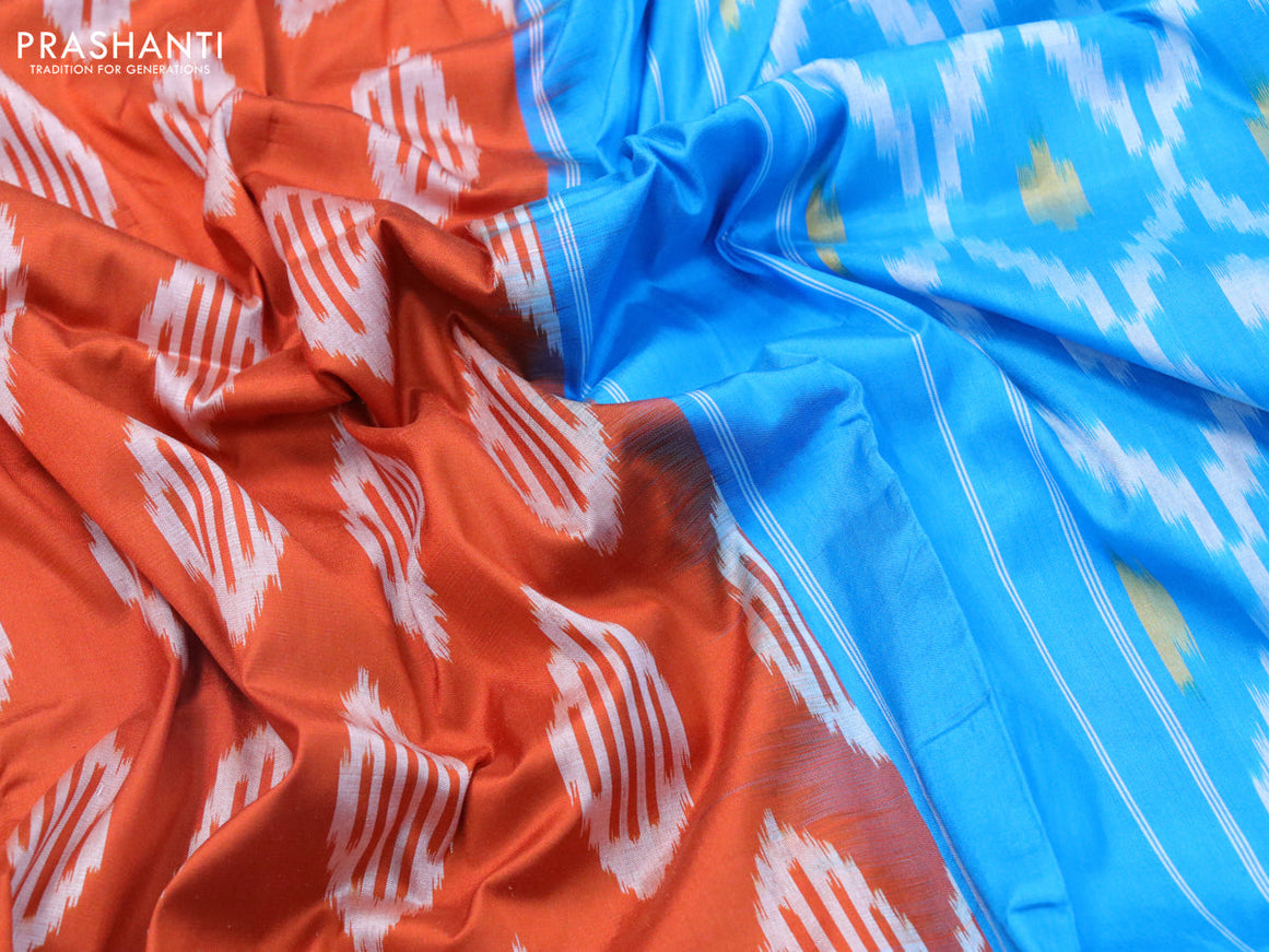 Pochampally silk saree orange and cs blue with allover ikat weaves and zari woven ikat style border