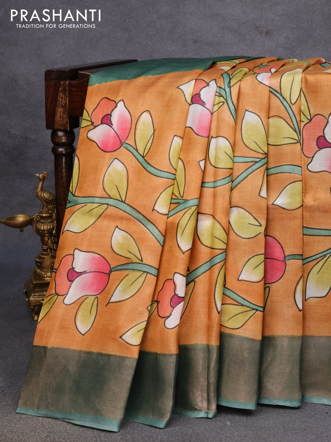 Pure tussar silk saree dark mustard and pastel green with allover floral kalamkari hand painted prints and zari woven border