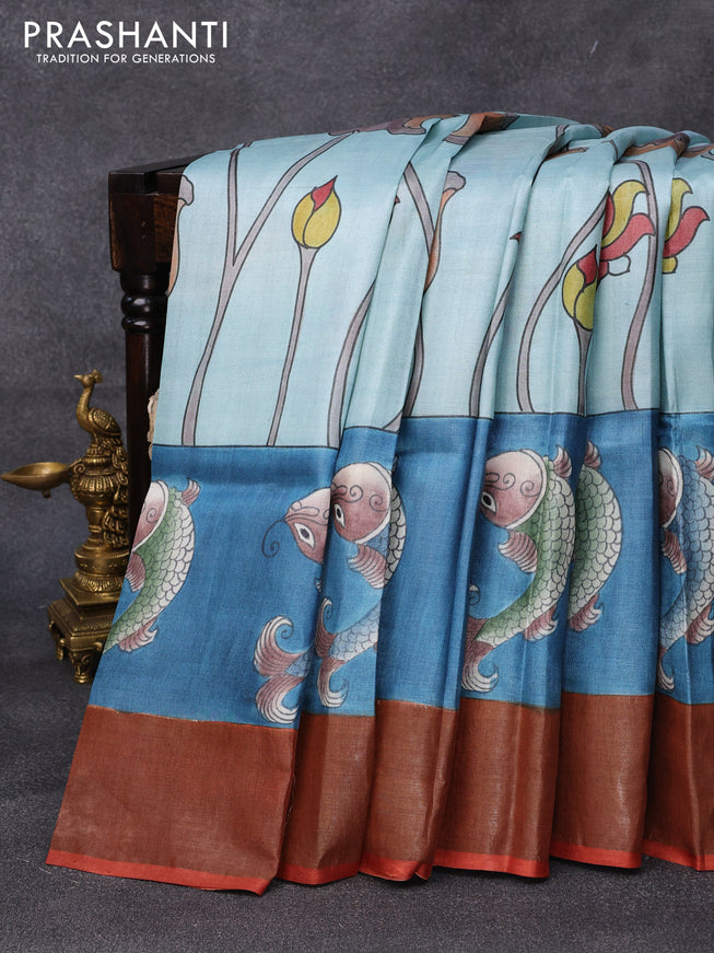 Pure tussar silk saree light blue and blue rustic orange with hand painted prints and zari woven border