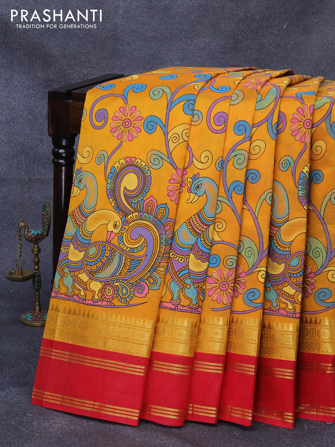 Silk cotton saree mango yellow and red with allover kalamkari prints and rettapet zari woven korvai border