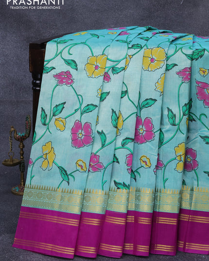 Silk cotton saree teal bluish green and purple with allover floral prints and rettapet zari woven korvai border