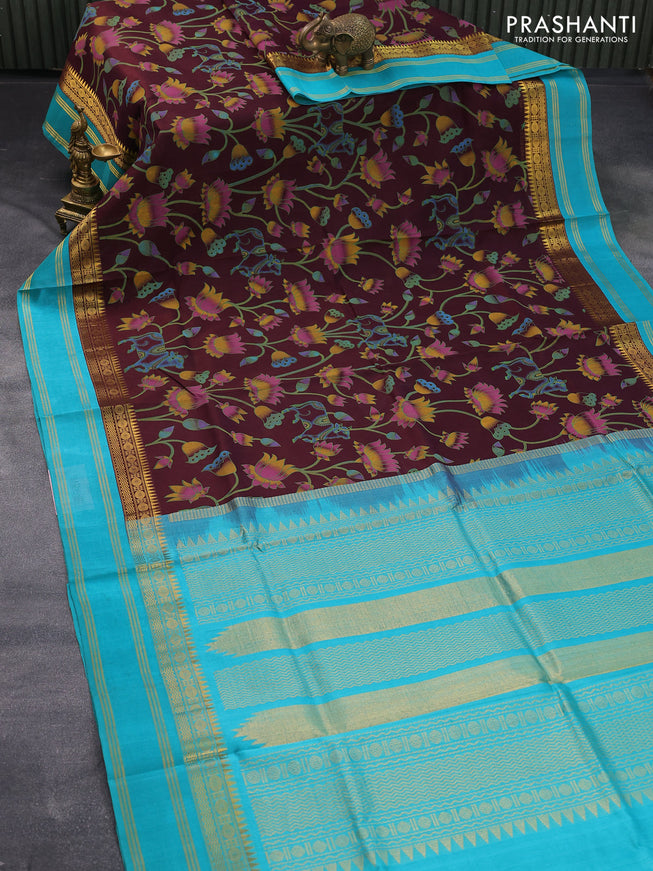 Silk cotton saree brown and teal blue with floral prints and rettapet zari woven korvai border