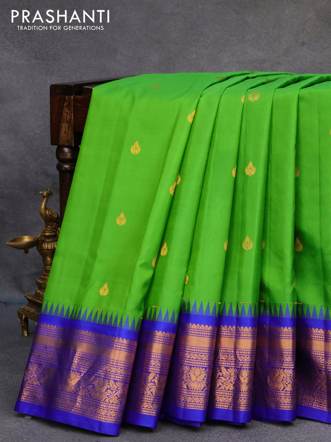 Pure gadwal silk saree light green and royal blue with zari woven buttas and temple design zari woven border