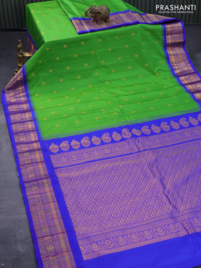 Pure gadwal silk saree light green and royal blue with zari woven buttas and temple design zari woven border