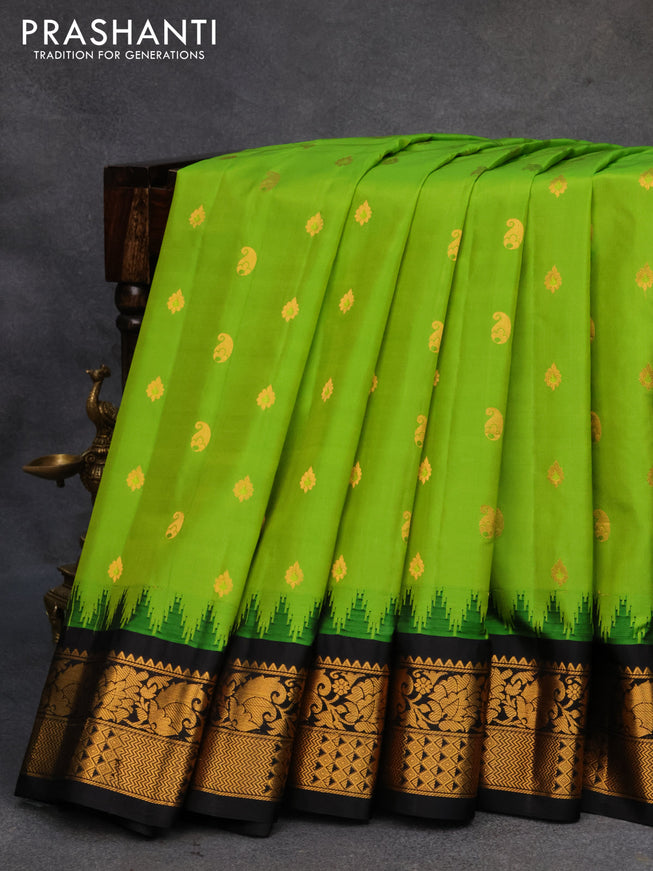 Pure gadwal silk saree light green and black with paisley zari woven buttas and temple design zari woven border