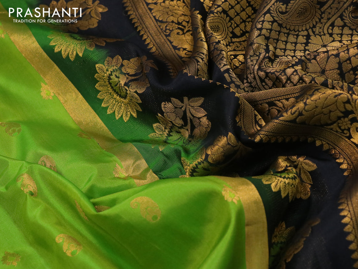 Pure gadwal silk saree light green and black with paisley zari woven buttas and temple design zari woven border