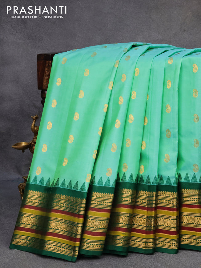 Pure gadwal silk saree teal green and green with paisley zari woven buttas and temple design annam zari woven border
