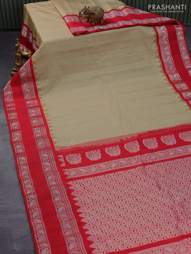 Pure gadwal silk saree pista green and red with allover stripes pattern and rettapet silver zari woven border