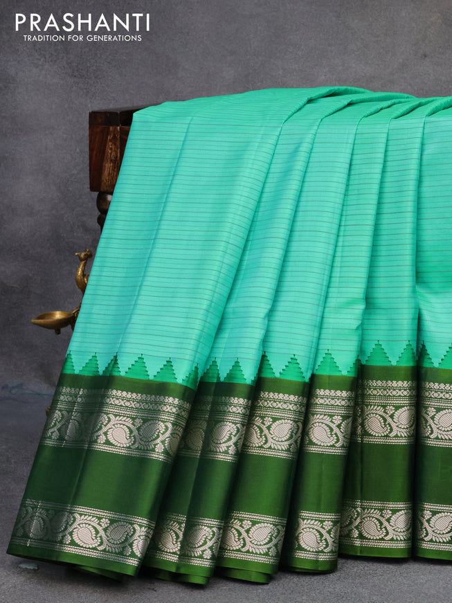 Pure gadwal silk saree teal bluish green and sap green with allover stripes pattern and rettapet silver zari woven border