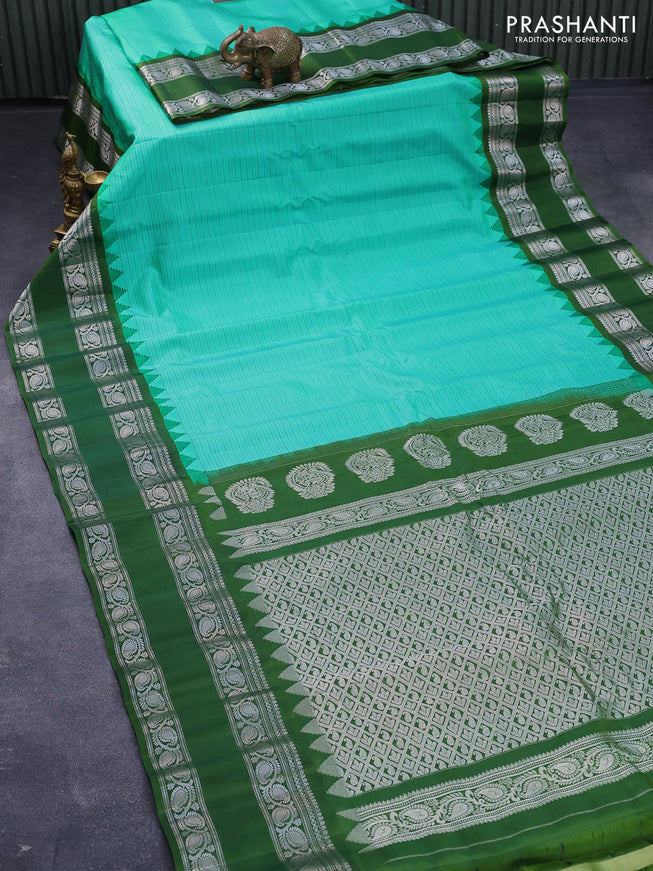 Pure gadwal silk saree teal bluish green and sap green with allover stripes pattern and rettapet silver zari woven border