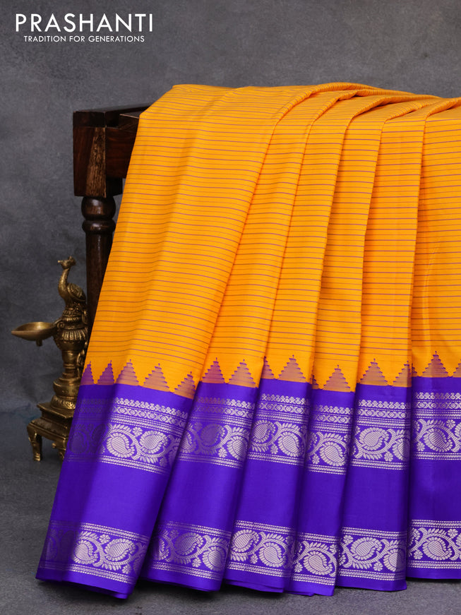 Pure gadwal silk saree mango yellow and blue with allover stripes pattern and rettapet silver zari woven border
