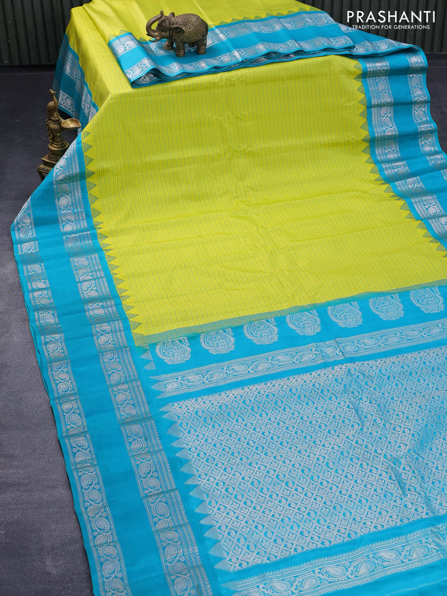 Pure gadwal silk saree lime yellow and teal blue with allover stripes pattern and rettapet silver zari woven border