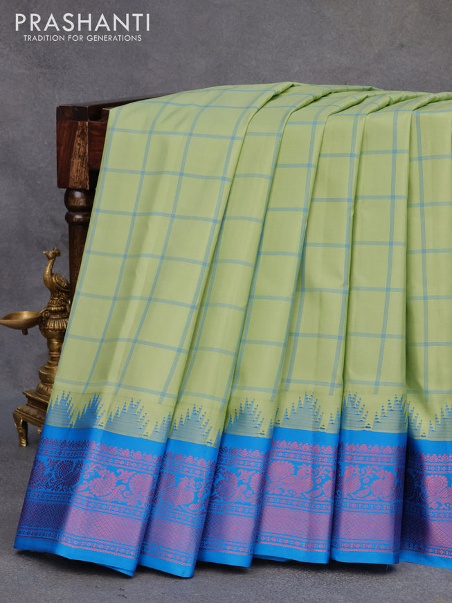 Pure gadwal silk saree pastel green and cs blue with allover checked pattern and temple design thread woven border