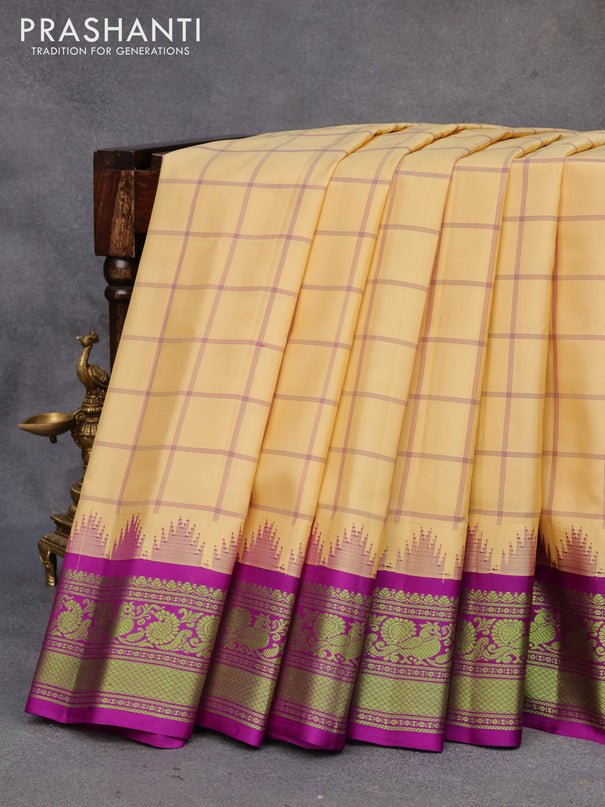 Pure gadwal silk saree sandal and deep purple with allover checked pattern and temple design thread woven border
