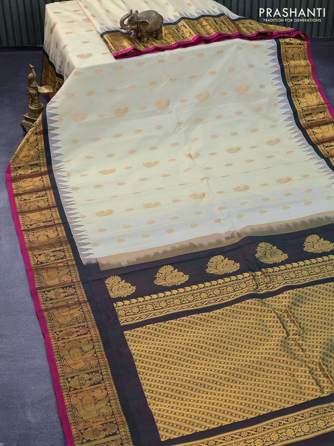 Pure gadwal silk saree cream and dark green with zari woven buttas and temple design annam zari woven border