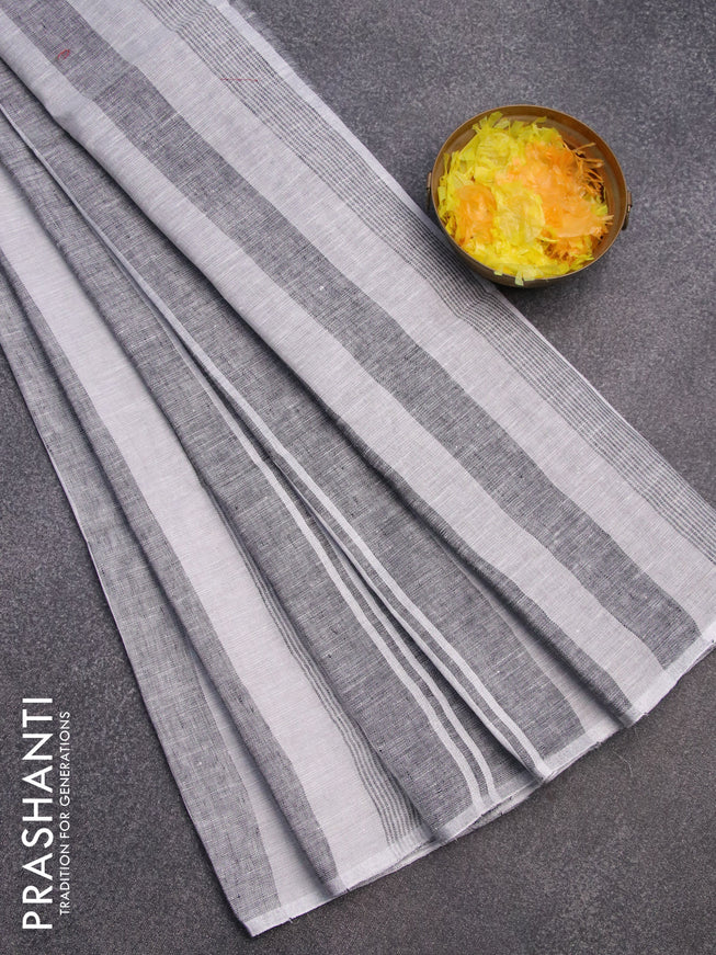 Pure linen saree off white and black with allover stripe pattern and silver zari woven piping border