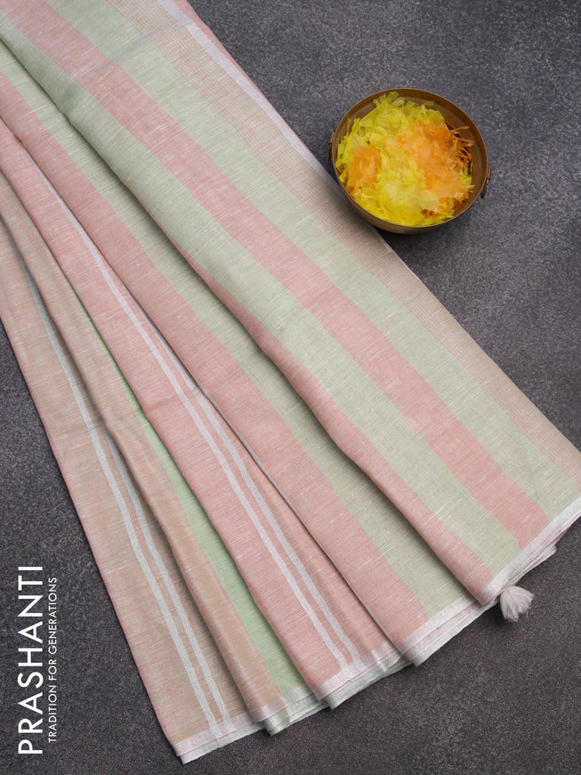 Pure linen saree pista green and pastel peach with allover stripe pattern and silver zari woven piping border
