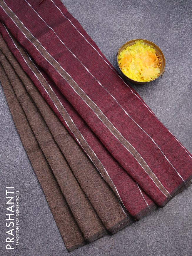 Pure linen saree pastel brown and maroon with plain body and piping border