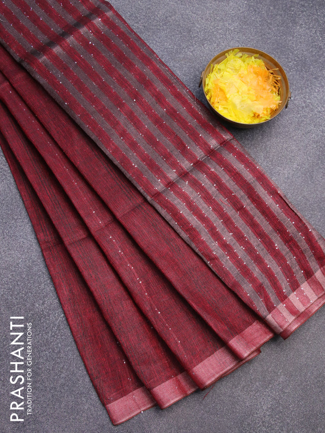 Pure linen saree maroon with allover sequin work and copper zari woven border