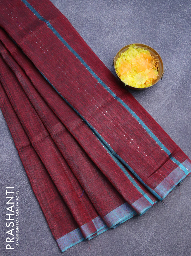 Pure linen saree maroon and teal blue with allover stripe pattern and sequin work pallu & piping border