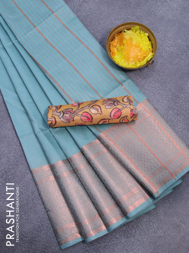 Semi tussar saree pastel shade of blue and mustard yellow with plain body and copper zari woven border & kalamkari printed blouse