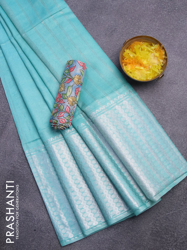 Semi tussar saree teal blue shade with plain body and silver zari woven border & kalamkari printed blouse