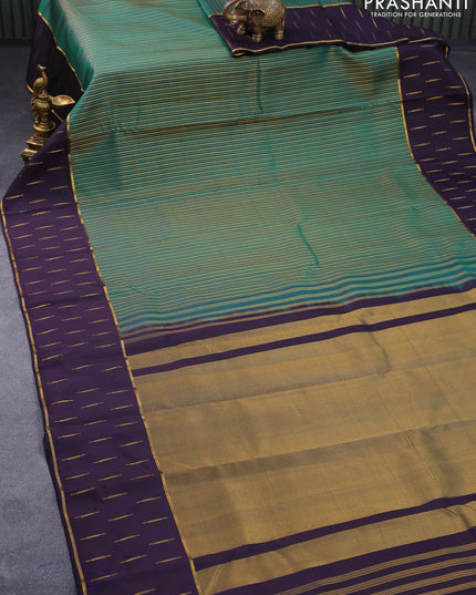 Pure kanjivaram silk saree green and deep jamun shade with allover zari weaves and rettapet zari woven butta border