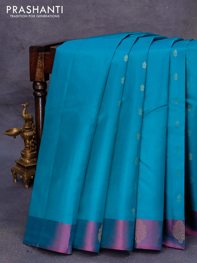 Pure kanjivaram silk saree teal blue and dual shade of purple with zari woven buttas and zari woven butta border
