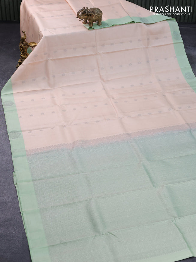 Pure kanjivaram silk saree cream and pista green with thread woven buttas and zari woven butta border