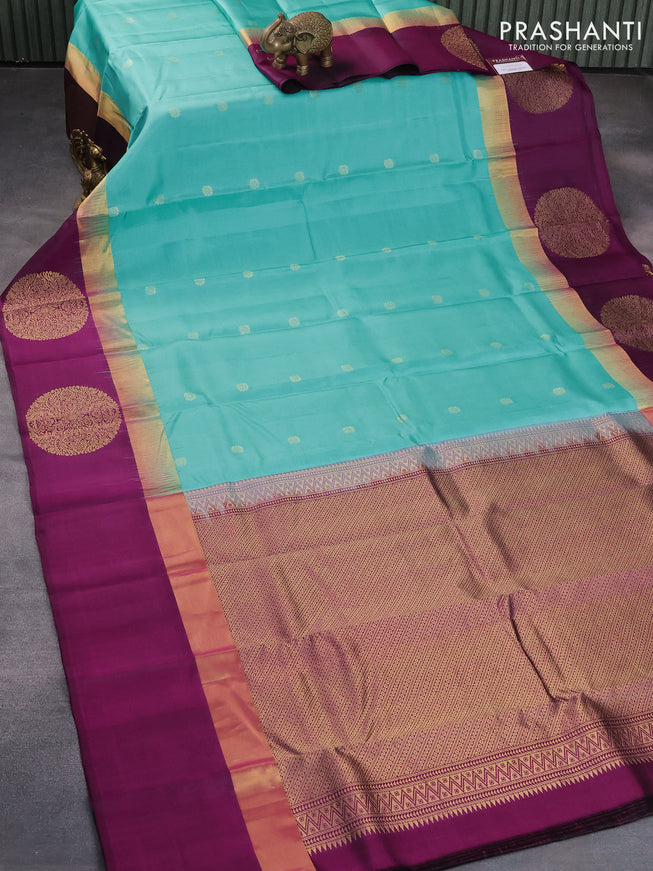 Pure kanjivaram silk saree light blue and purple with zari woven buttas and zari woven butta border
