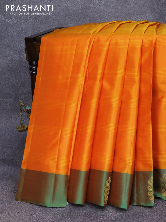 Pure kanjivaram silk saree dual shade of mustard and dual shade of green with plain body and peacock zari woven butta border