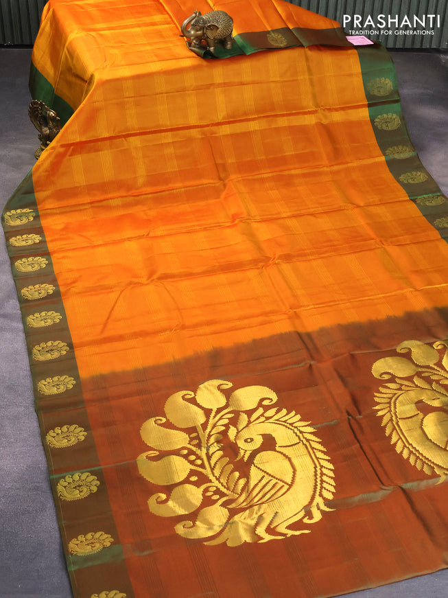 Pure kanjivaram silk saree dual shade of mustard and dual shade of green with plain body and peacock zari woven butta border