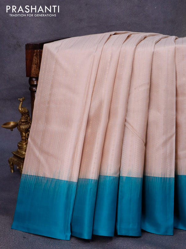 Pure kanjivaram silk saree beige and teal blue with allover zari weaves and simple border