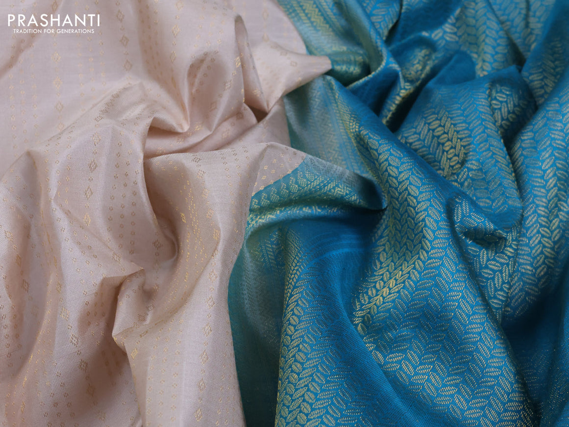 Pure kanjivaram silk saree beige and teal blue with allover zari weaves and simple border
