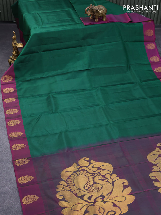 Pure kanjivaram silk saree green and magenta pink with plain body and zari woven butta border
