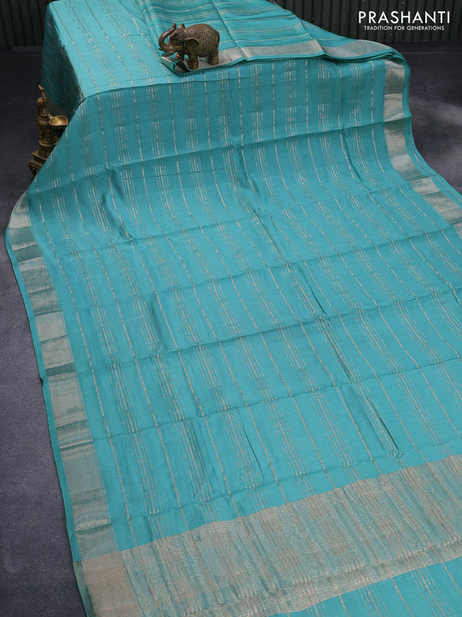 Semi chanderi saree teal blue with allover zari weaves and zari woven border - printed blouse