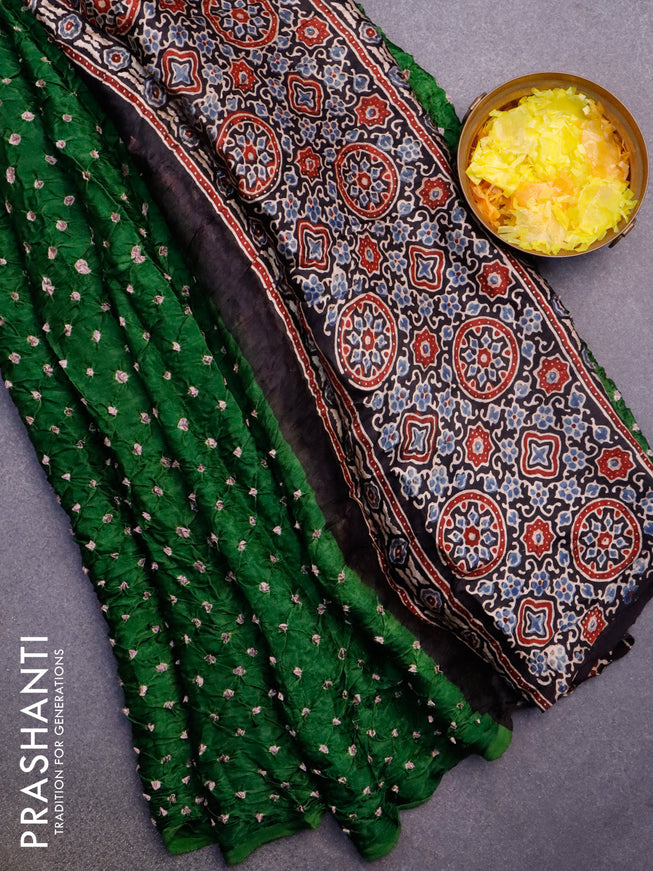 Modal silk saree green and black with allover bandhani prints and ajrakh printed pallu