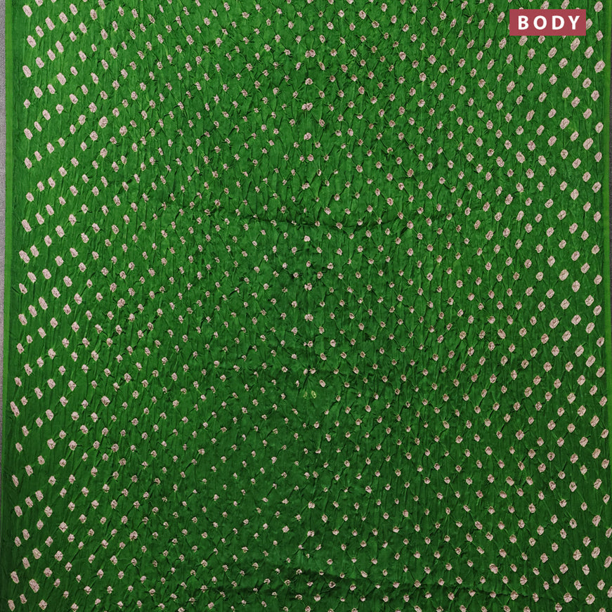 Modal silk saree green and black with allover bandhani prints and ajrakh printed pallu