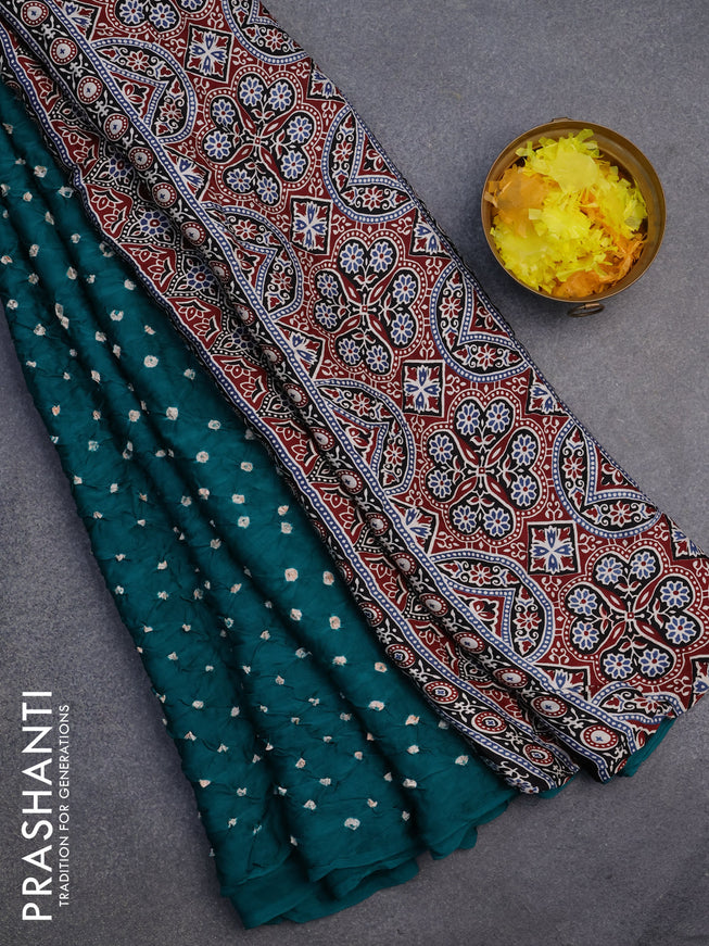 Modal silk saree teal green and black with allover bandhani prints and ajrakh printed pallu